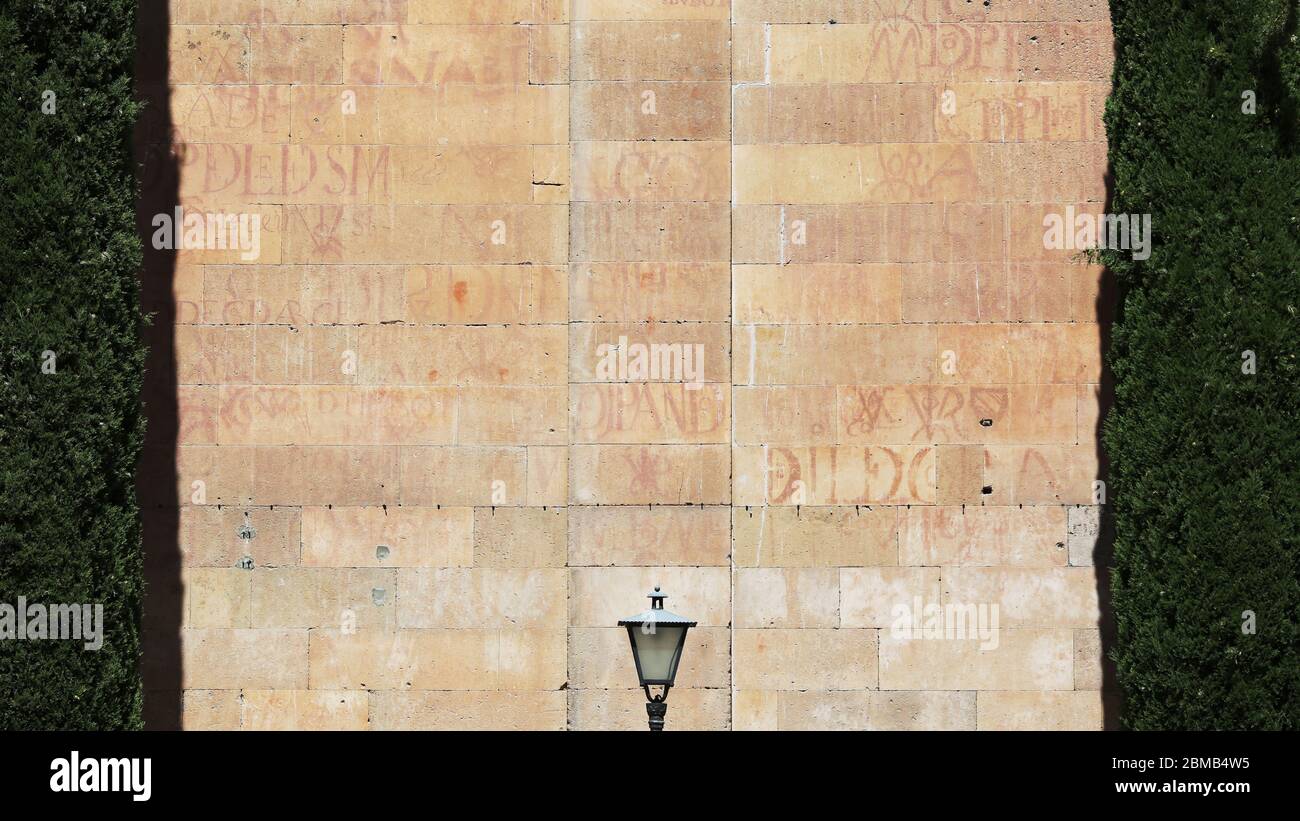 A traditional ochre wall with traditional typesetting in Salamanca, Spain. Stock Photo