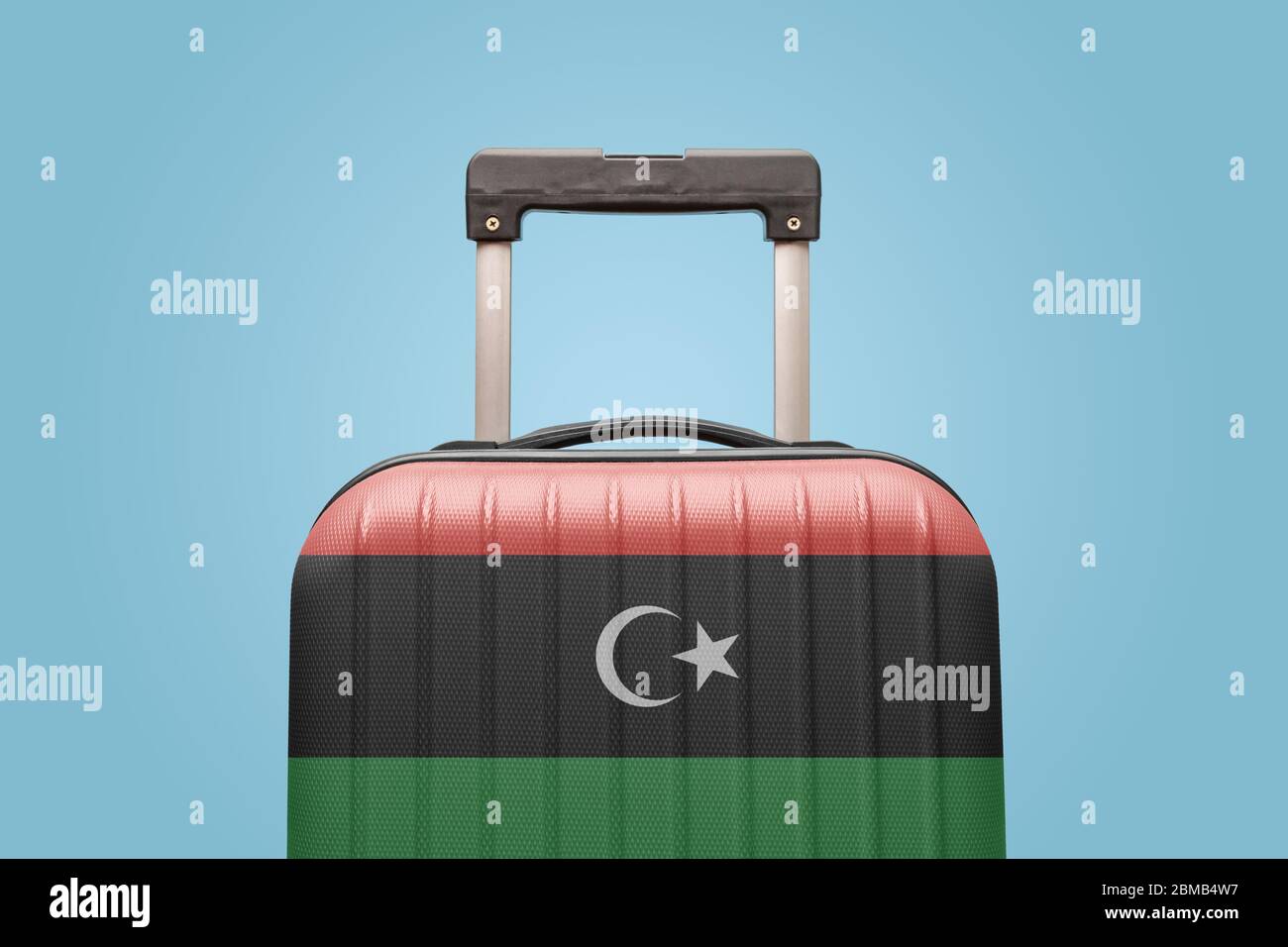 Suitcase with Libyan flag design travel Africa concept. Stock Photo