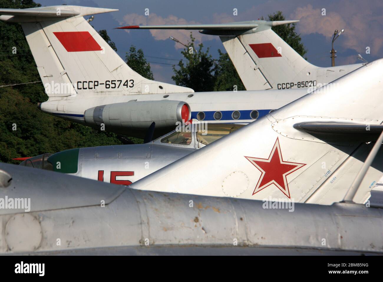 Aircraft tails with Soviet stars, flags and registration markings at the Zhulyany State Aviation Museum of Ukraine: MiG-17, MiG-19, Tu-134 und Tu-154 Stock Photo