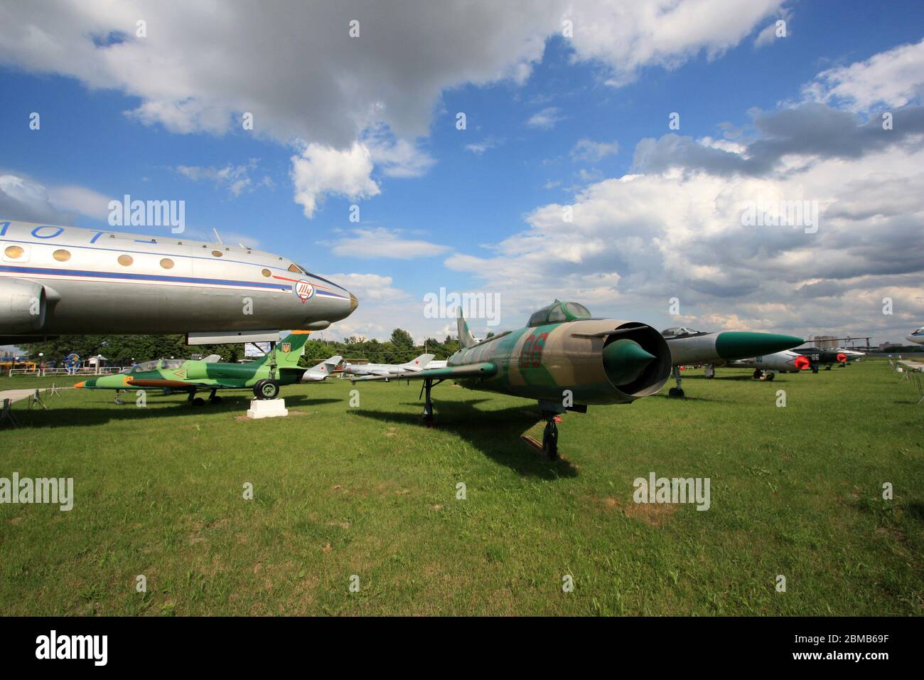 View of a Sukhoi Su-7 'Fitter-A' supersonic fighter next to a Aeroflot Tupolev Tu-104 jetliner at the Zhulyany State Aviation Museum of Ukraine Stock Photo