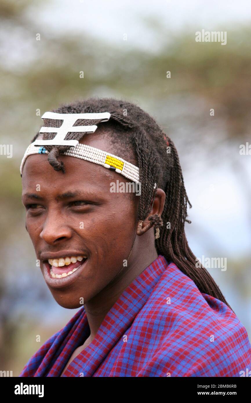 Portrait of a young Maasai tribesman. Maasai is an ethnic group of semi-nomadic people. Photographed in Tanzania Stock Photo
