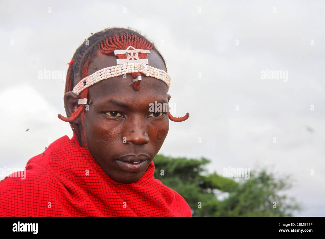 Portrait of a young Maasai tribesman. Maasai is an ethnic group of semi-nomadic people. Photographed in Tanzania Stock Photo