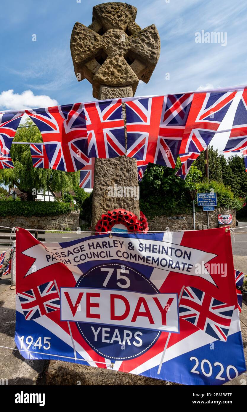 VE day decorations, flags and bunting, on the War Memorial at Cressage