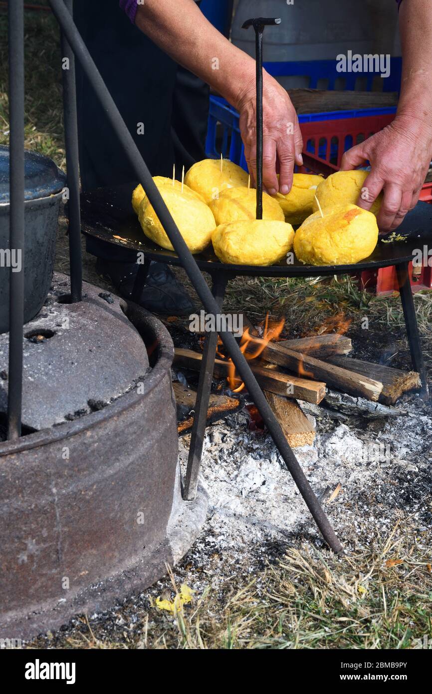 Balls of polenta and cheese in the middle of it, named bulz, a ...