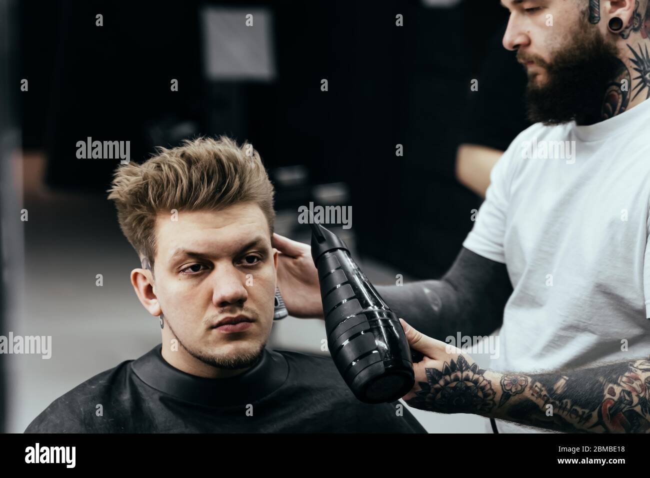 Combing hair styling in barber hi-res stock photography and images - Alamy