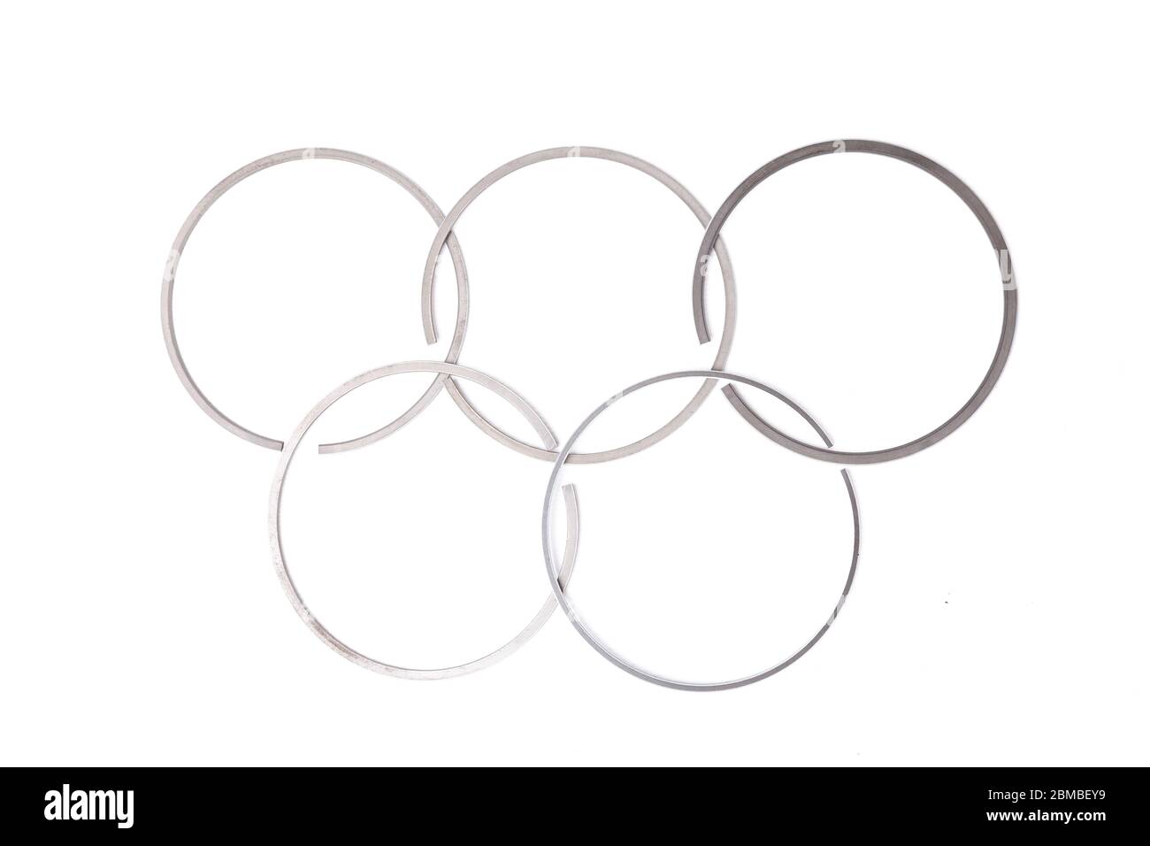 metal piston rings of a car engine placed on a white background in the form of an olympic symbol designer pattern creativity mechanic at work 2BMBEY9