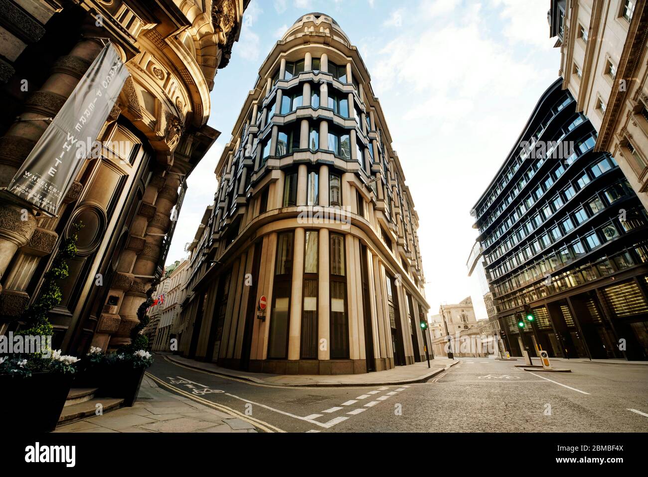 Wide angle architectural shot of the empty City of London; 1 Threadneedle Street building in the centre. Day 7 of the lockdown, London, UK. Mar 2020 Stock Photo