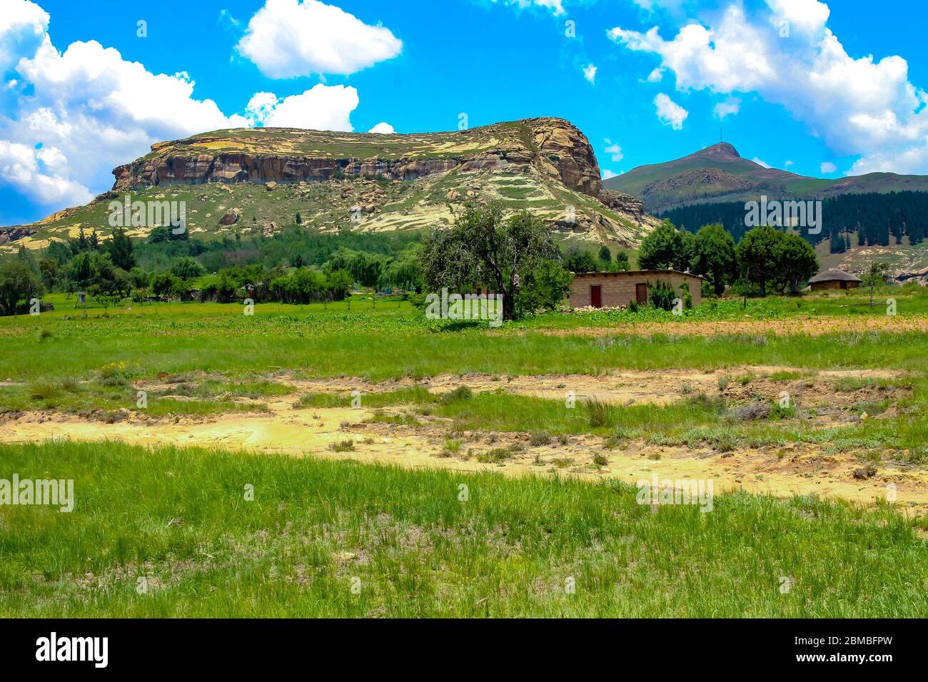 Small village and Drakensberg mountain landscape in Lesotho, Southern Africa. Stock Photo