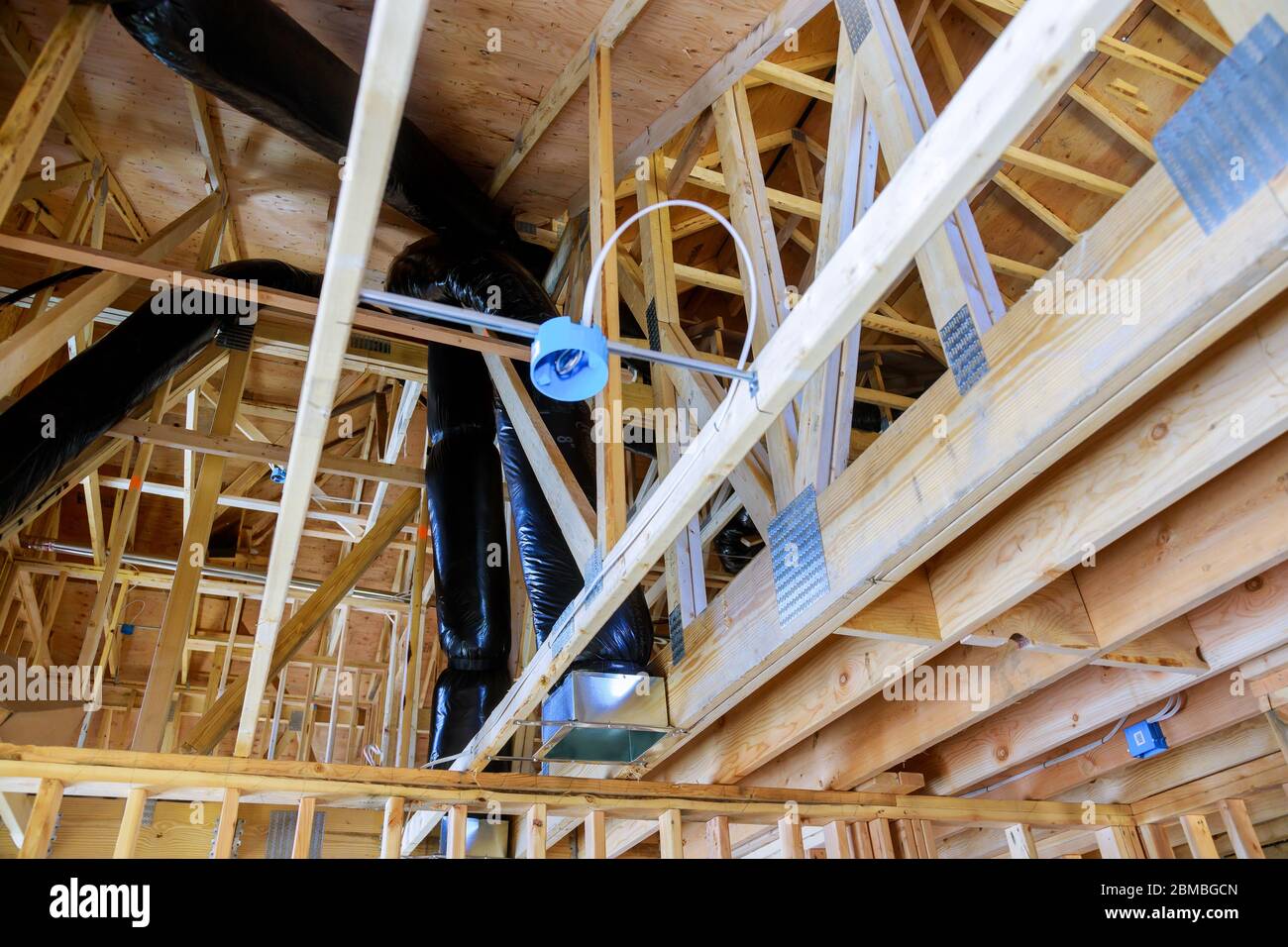 House under construction roof of HVAC vents being installed air