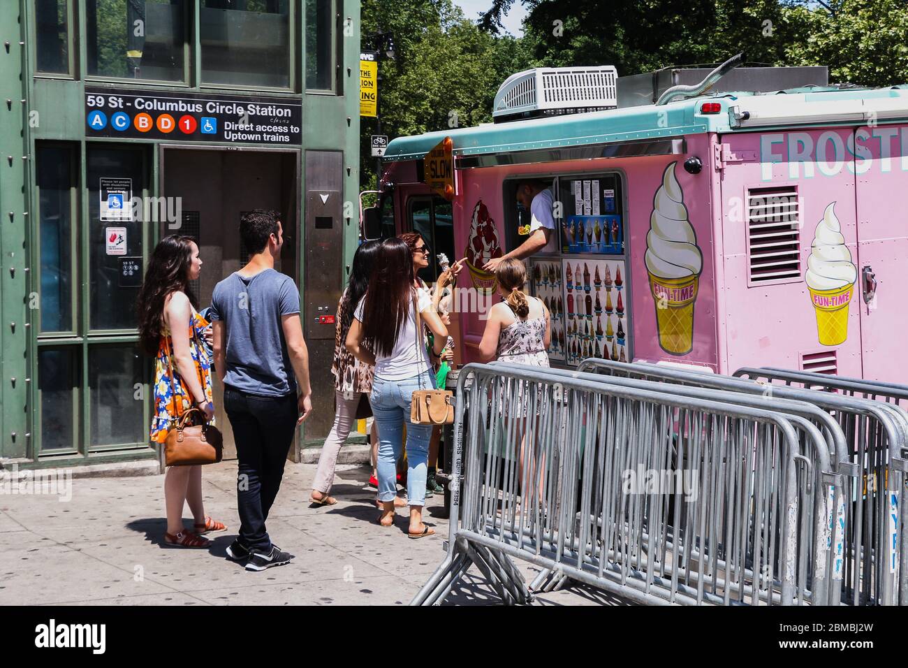 Tourists getting ice cream from an ice cream truck in Columbus Circle