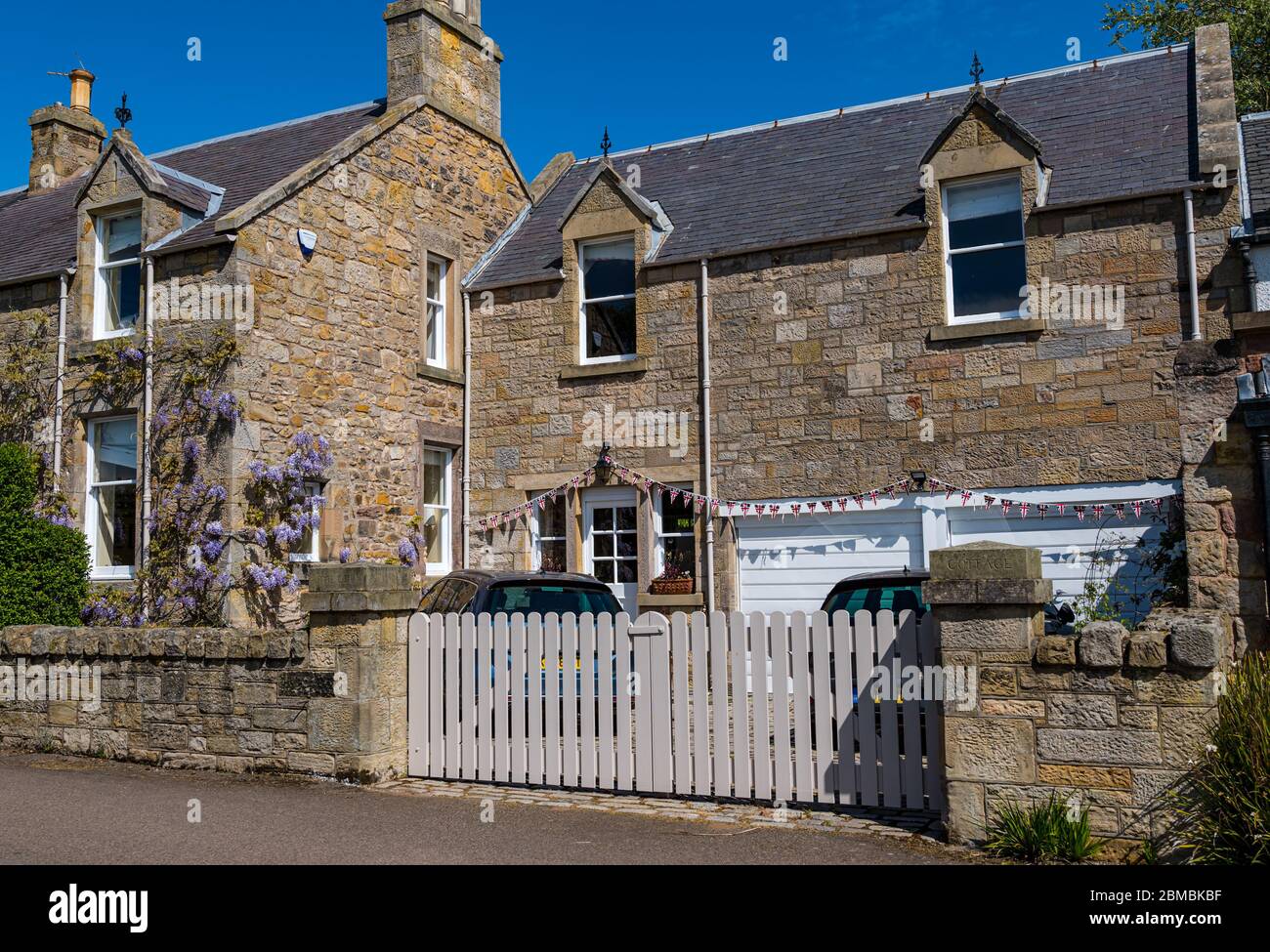 Goose Green, Gullane, East Lothian, Scotland, United Kingdom. 8th May, 2020. VE Day celebrations: Bunting decorates a house in the village on the 75th commemoration of Victory in Europe Stock Photo