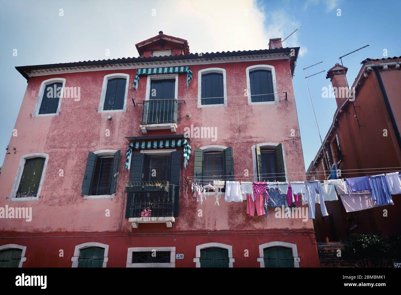 Clothesline between buildings hires stock photography and images Alamy