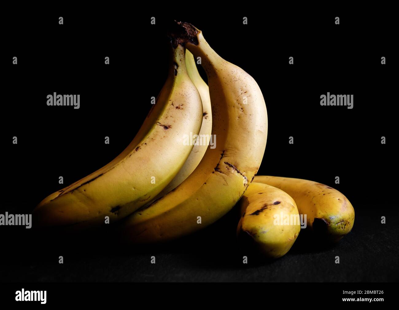 Canarian banana still life Spain chiaroscuro isolated on a black dark
