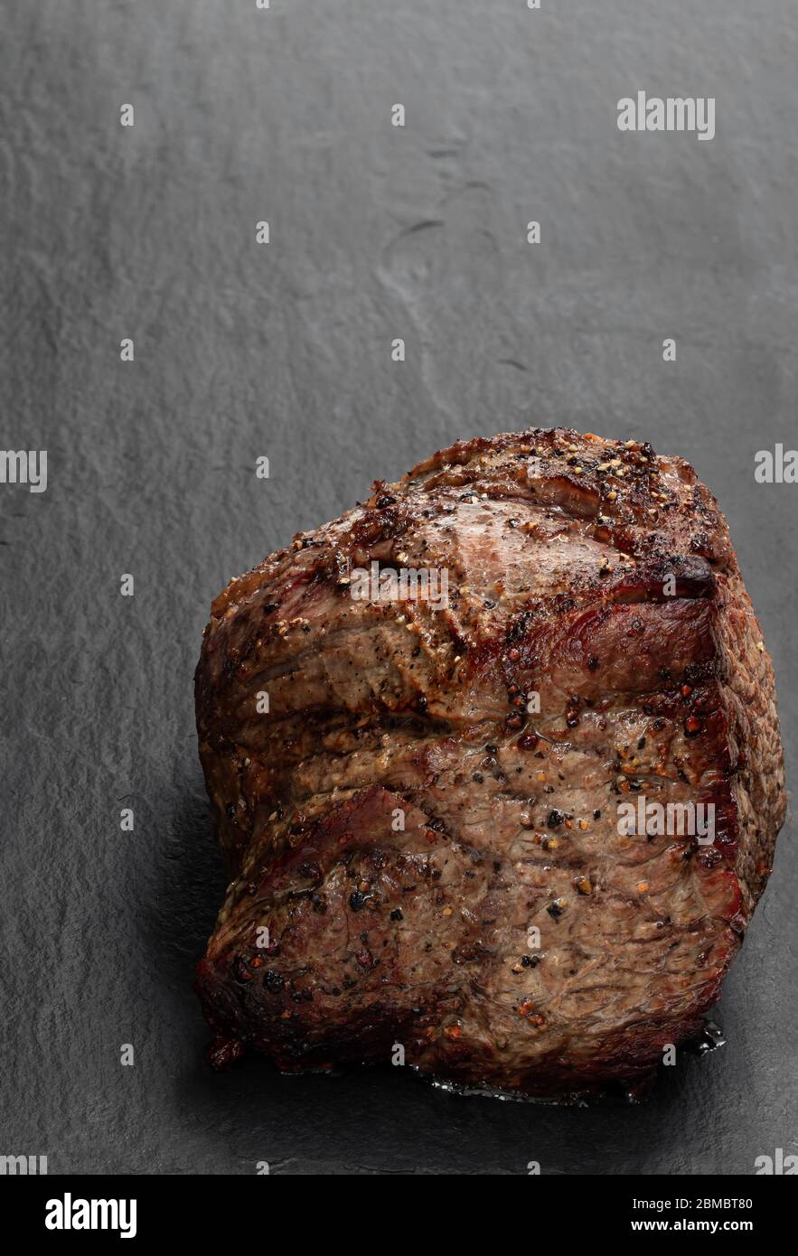 Roast Beef On Black Stone Background Stock Photo Alamy