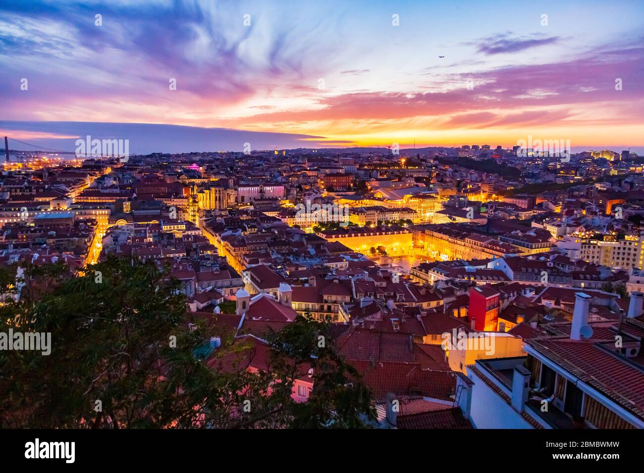 Beautiful panorama of old town and Baixa district in Lisbon city at evening, seen from Sao Jorge Castle hill, Portugal Stock Photo