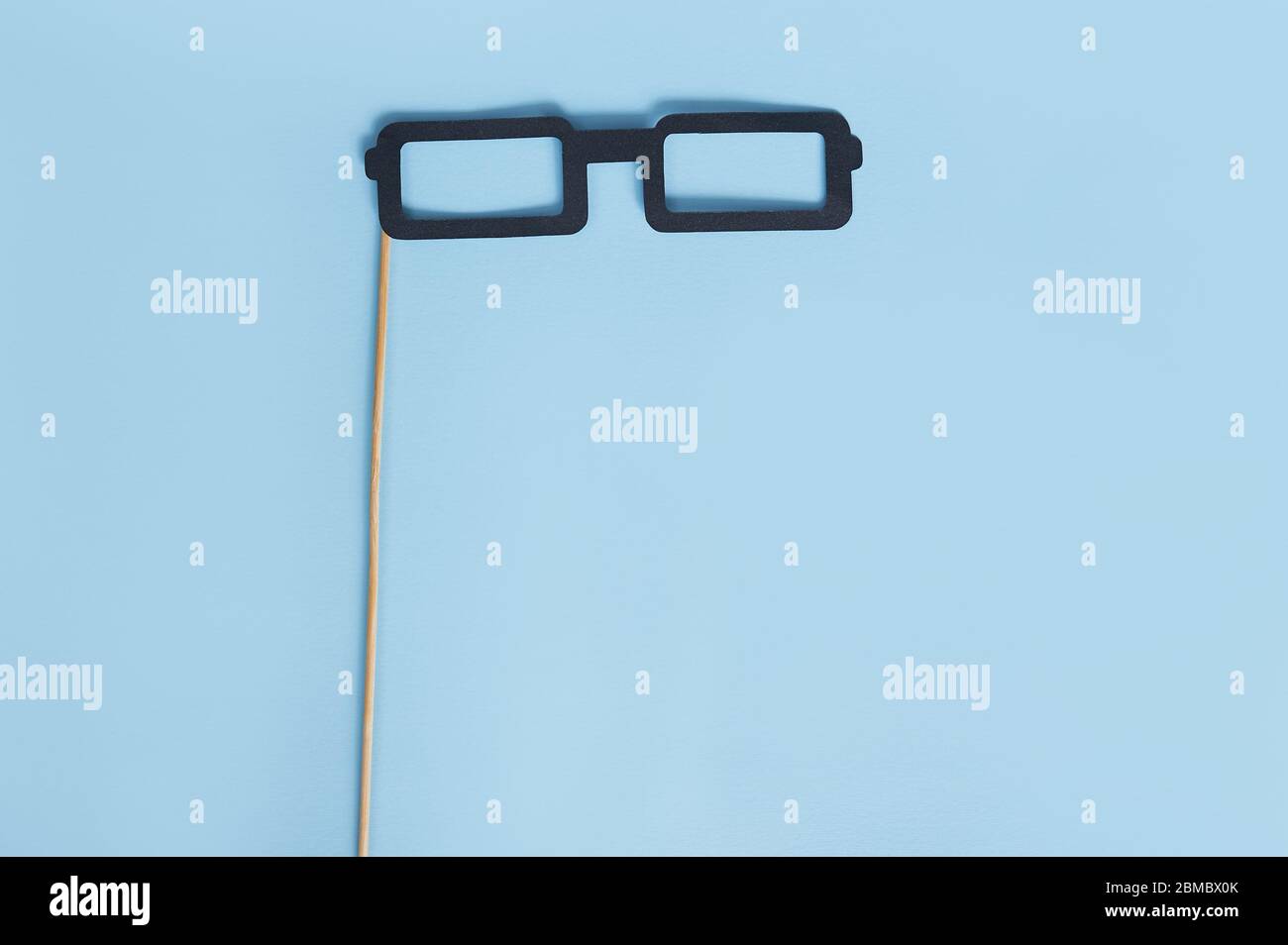 Paper glasses on a blue background, November blue, Movember men health and Hipster Father's day concept with place for your text Stock Photo