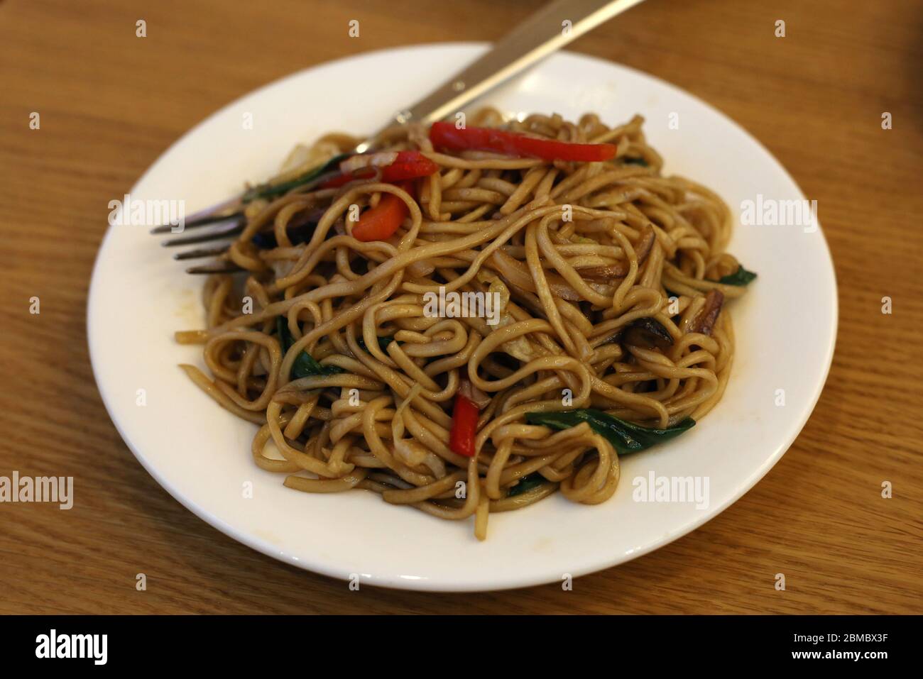 Fried noodles with vegetables served in Din Tai Fung restaurant of Mall
