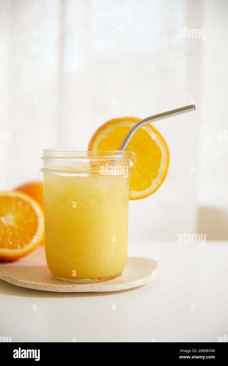 Refreshing Orange Juice with Metal Straw Stock Photo Alamy