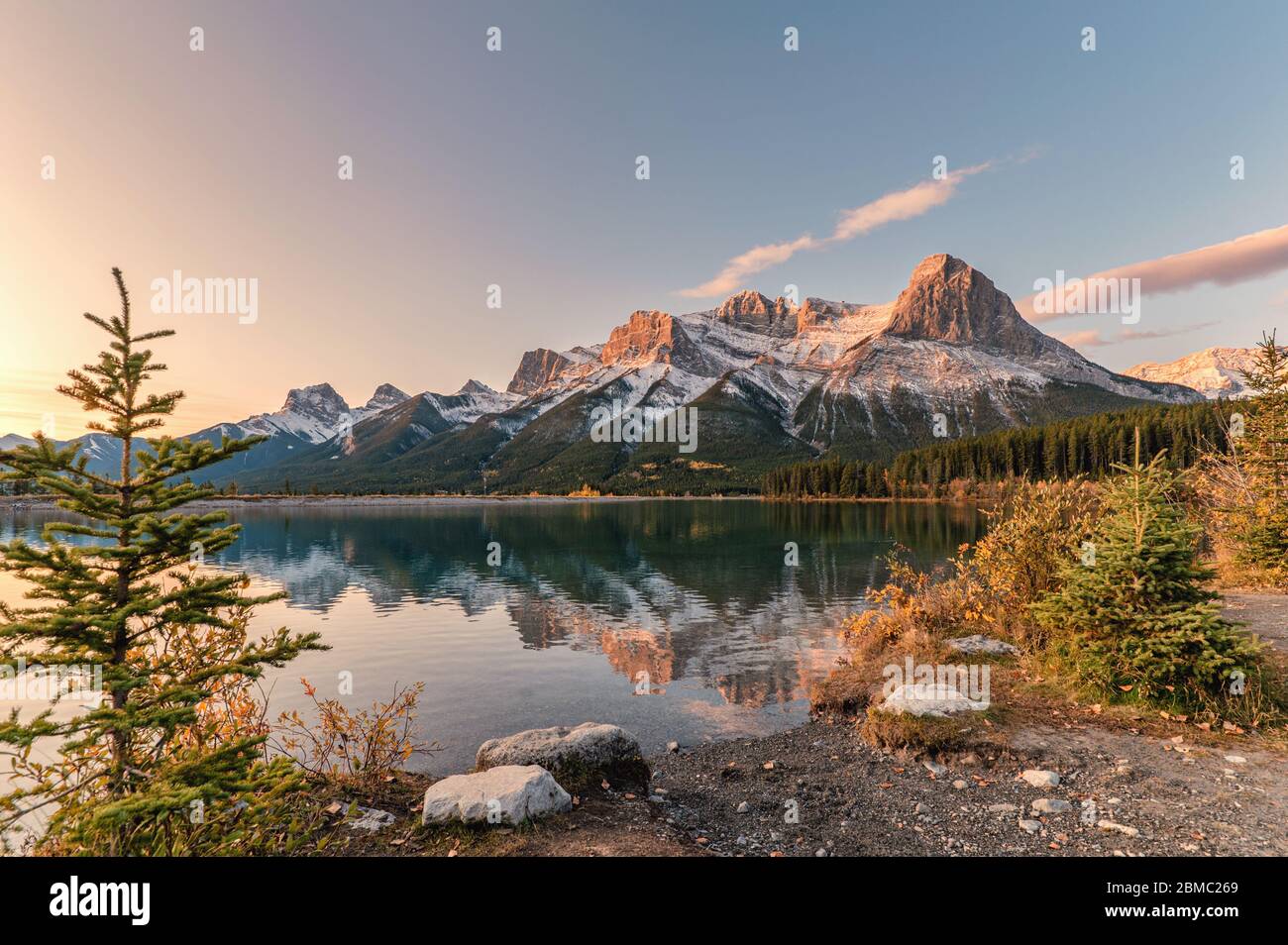 Sunrise on Mount Rundle with colorful sky reflection on Rundle Forebay