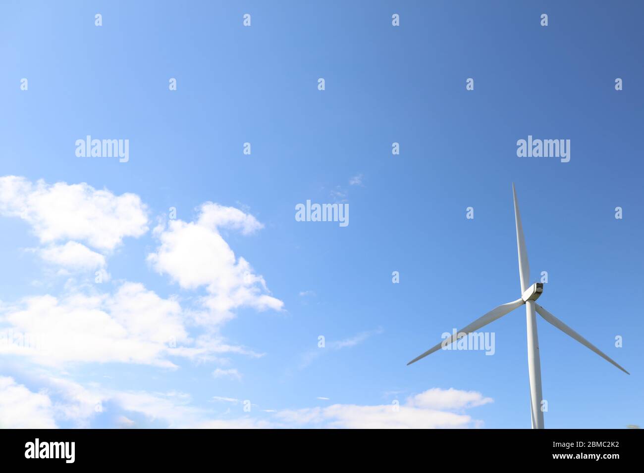 Windmill turbine with blue sky Stock Photo - Alamy