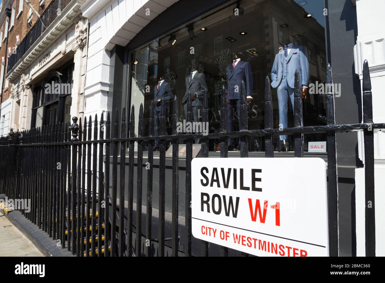 Westminster street sign on Savile Row in London, the Golden mile of bespoke tailoring, is