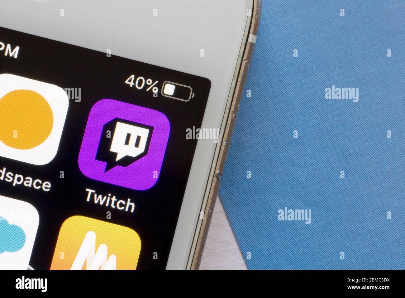 Twitch mobile app icon is seen on a smartphone. Twitch is a video live streaming service operated by Twitch Interactive, a subsidiary of Amazon. Stock Photo