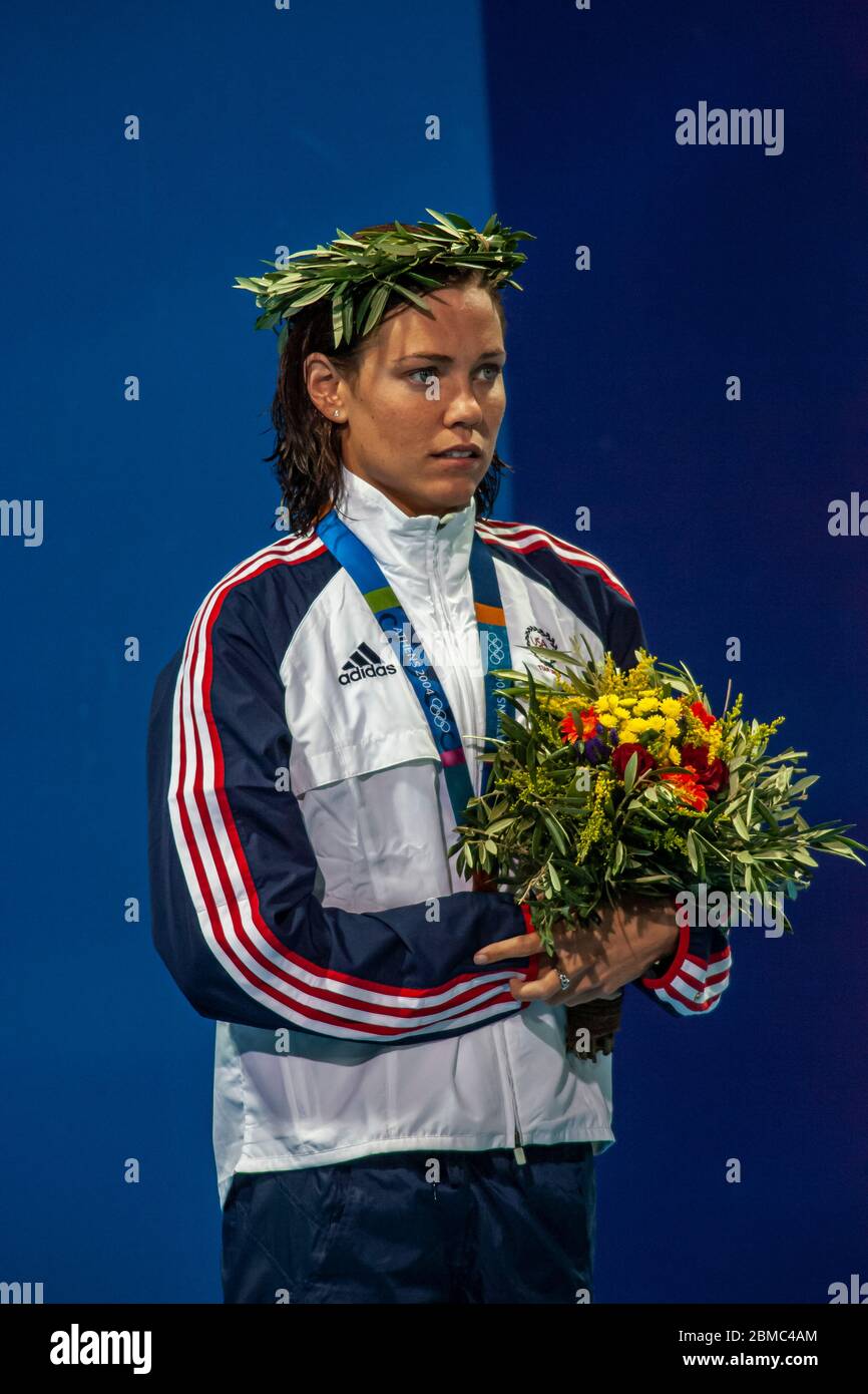 Natalie Coughlin (USA) wins the gold medal in the  Women's 100 metre backstroke final at the 2004 Olympic Summer Games, Athens. Stock Photo