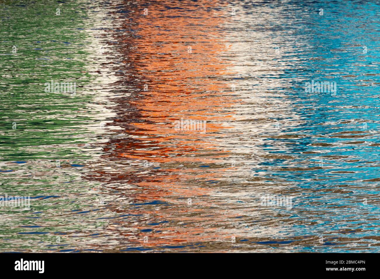 Reflections in the water of colourful house facades at the fishing