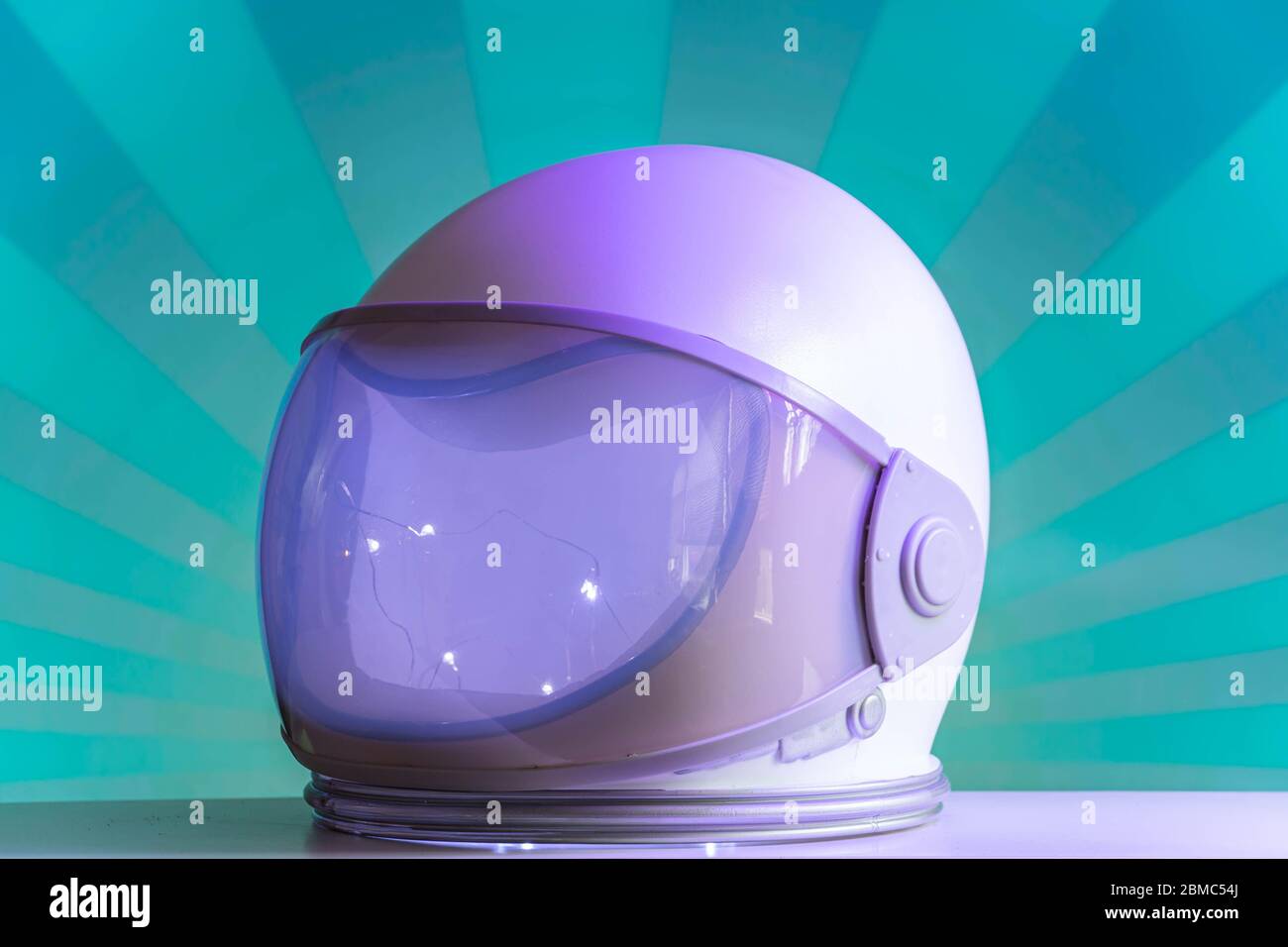 Plastic Astronaut Helmet Space Suit Futuristic Costume With Purple Lighting And A Modern Pop Background Stock Photo Alamy