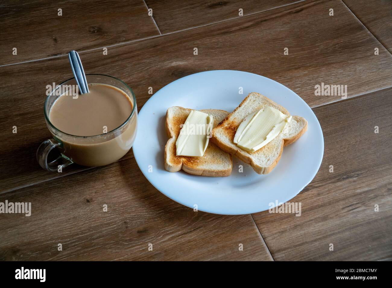Cup Of Coffe With Milk And Two Slices Of Toasted Sandwich Buttered Bread On A White Plate Healthy Breakfast With Coffee Free Space For Text Side Vi Stock Photo Alamy