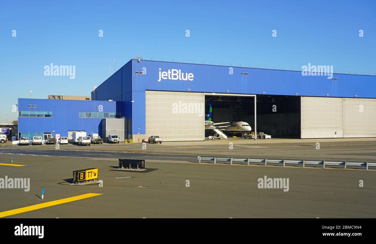 NEW YORK -23 NOV 2019-  An airplane from JetBlue (B6) in a Jet Blue maintenance hangar at the John F. Kennedy International Airport (JFK) in New York Stock Photo