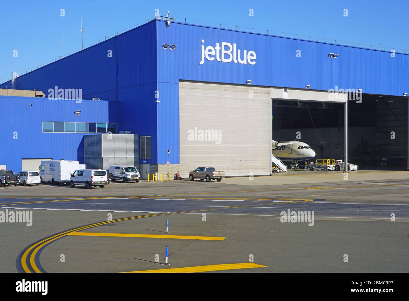 NEW YORK -23 NOV 2019-  An airplane from JetBlue (B6) in a Jet Blue maintenance hangar at the John F. Kennedy International Airport (JFK) in New York Stock Photo