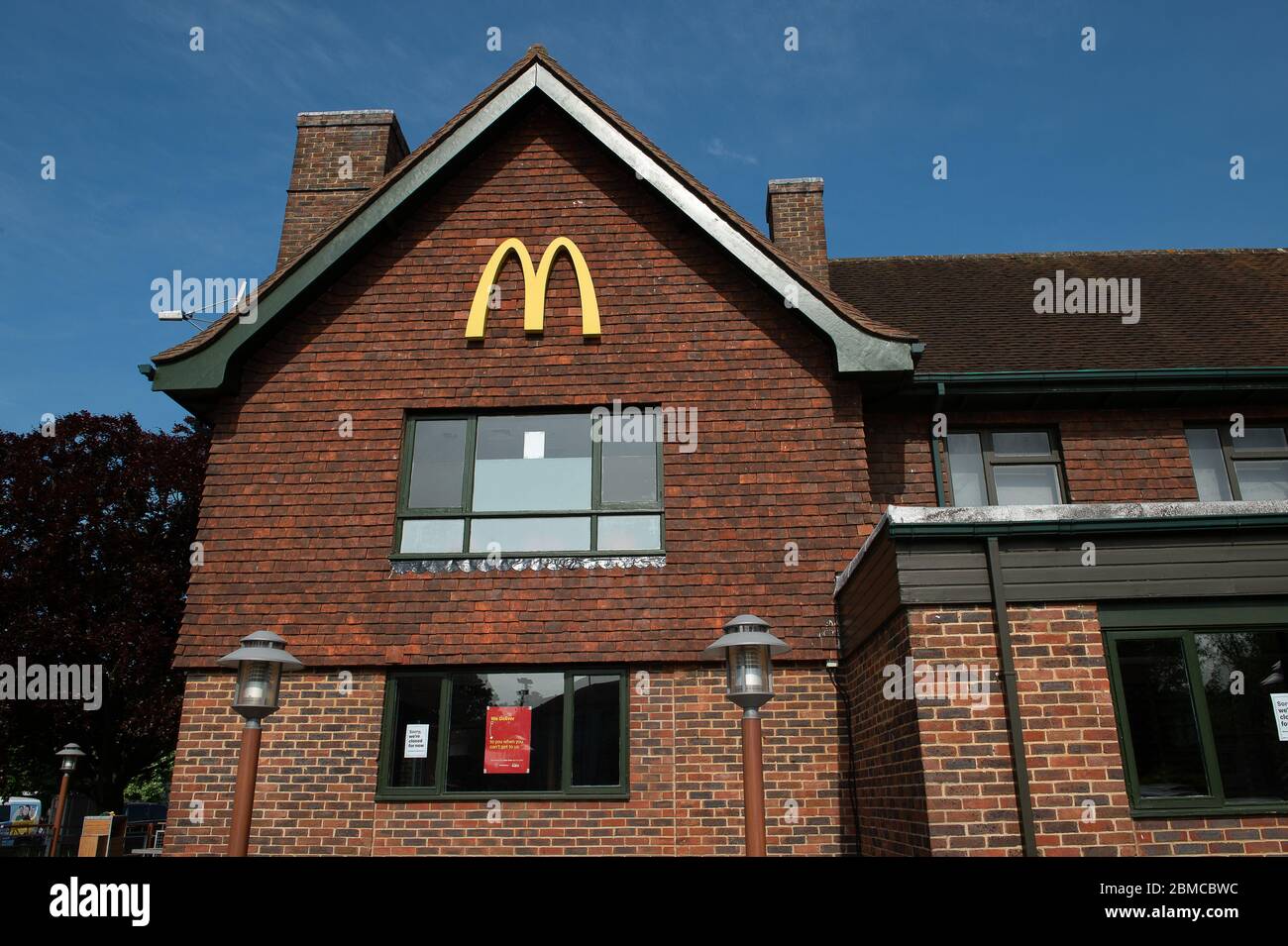 Slough, Berkshire, UK. 7th May, 2020. McDonald's have announced that 15 of their UK restaurants are reopening on 13th May 2020 to do home deliveries only via Uber Eats and Just Eat. Their restaurants have been shut during the Coronavirus Pandemic lockdown. The Slough McDonald's Prince of Wales Drive Thru remains temporarily closed. Credit: Maureen McLean/Alamy Stock Photo