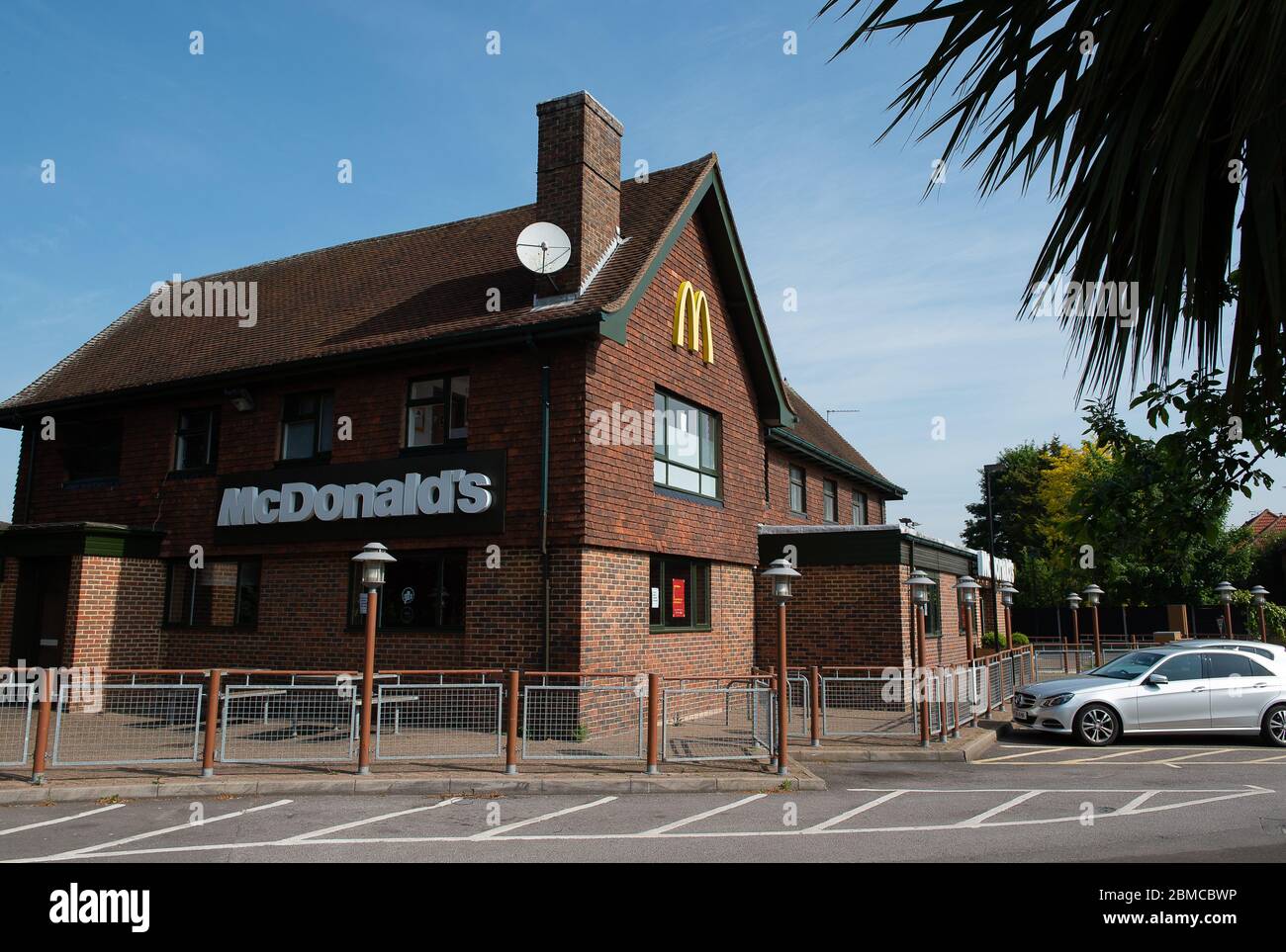 Slough, Berkshire, UK. 7th May, 2020. McDonald's have announced that 15 of their UK restaurants are reopening on 13th May 2020 to do home deliveries only via Uber Eats and Just Eat. Their restaurants have been shut during the Coronavirus Pandemic lockdown. The Slough McDonald's Prince of Wales Drive Thru remains temporarily closed. Credit: Maureen McLean/Alamy Stock Photo