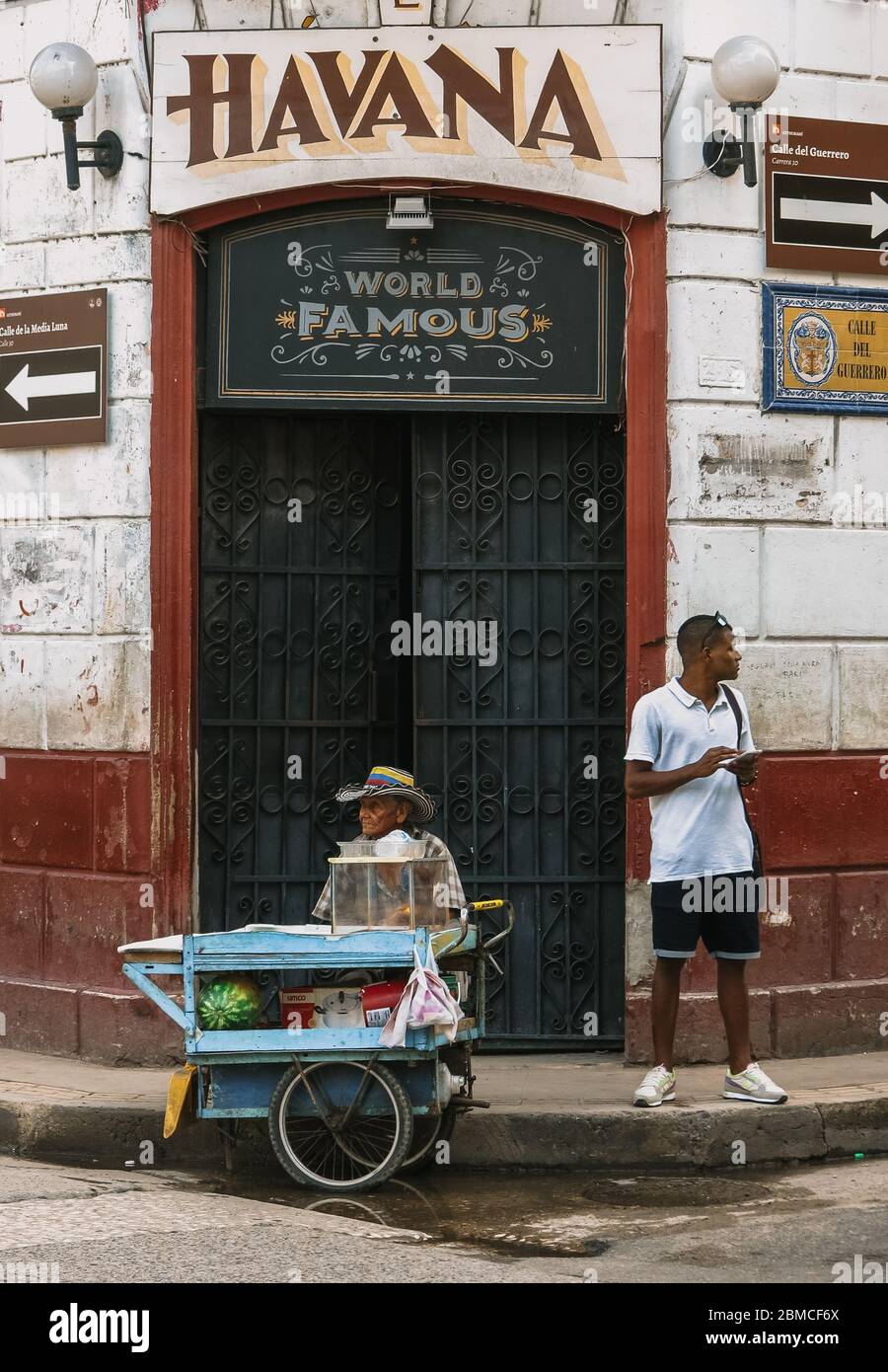 Two men outside of Cafe Havana in Cartagena, Colombia Photo - Alamy