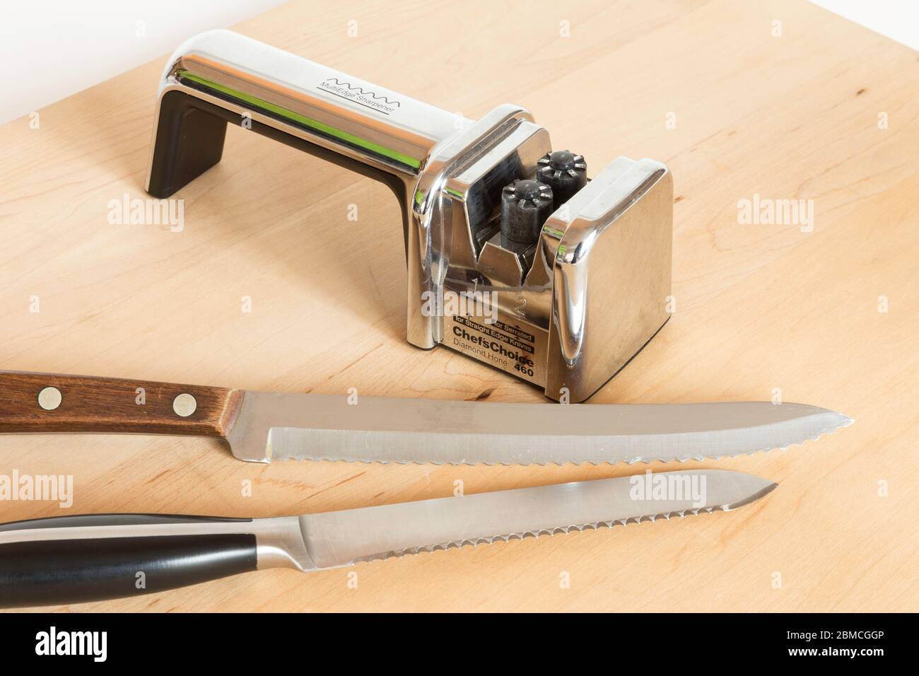 Knife sharpener with serrated knives still life, USA Stock Photo - Alamy