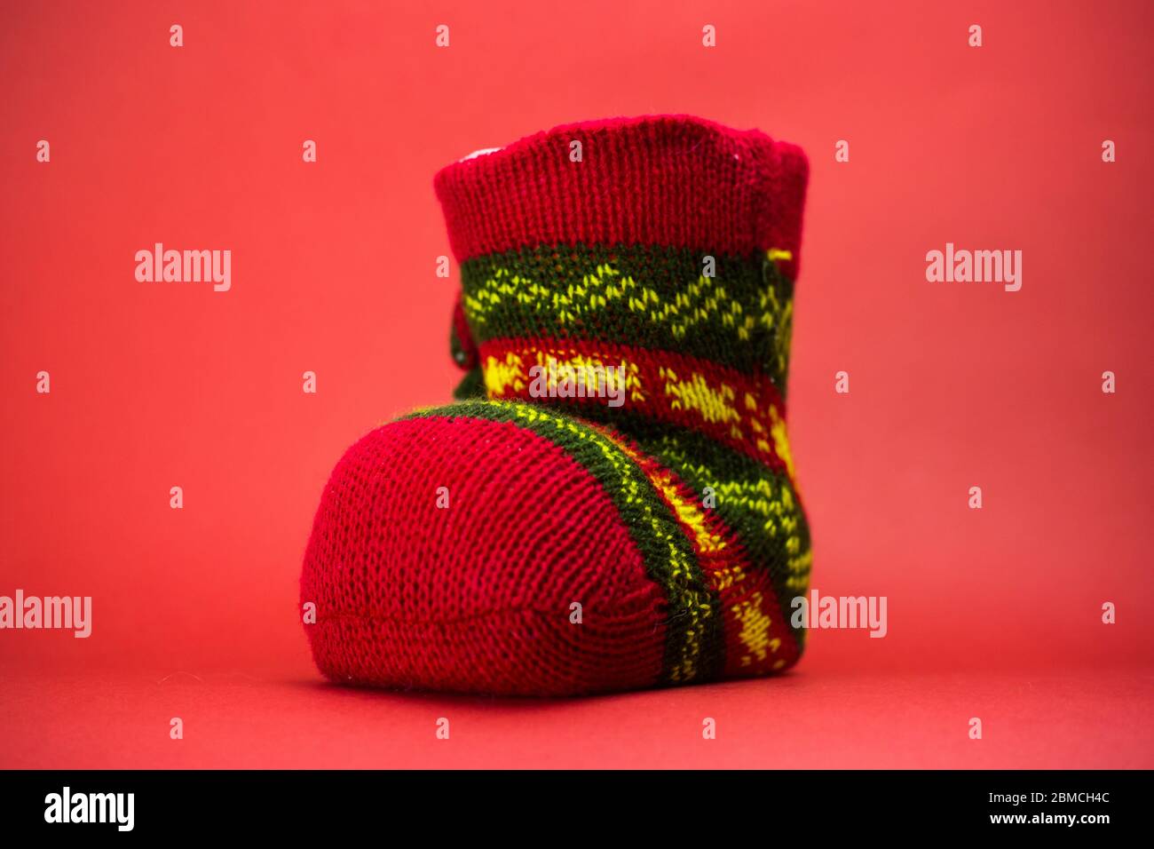 Christmas knitted gift sock Stock Photo