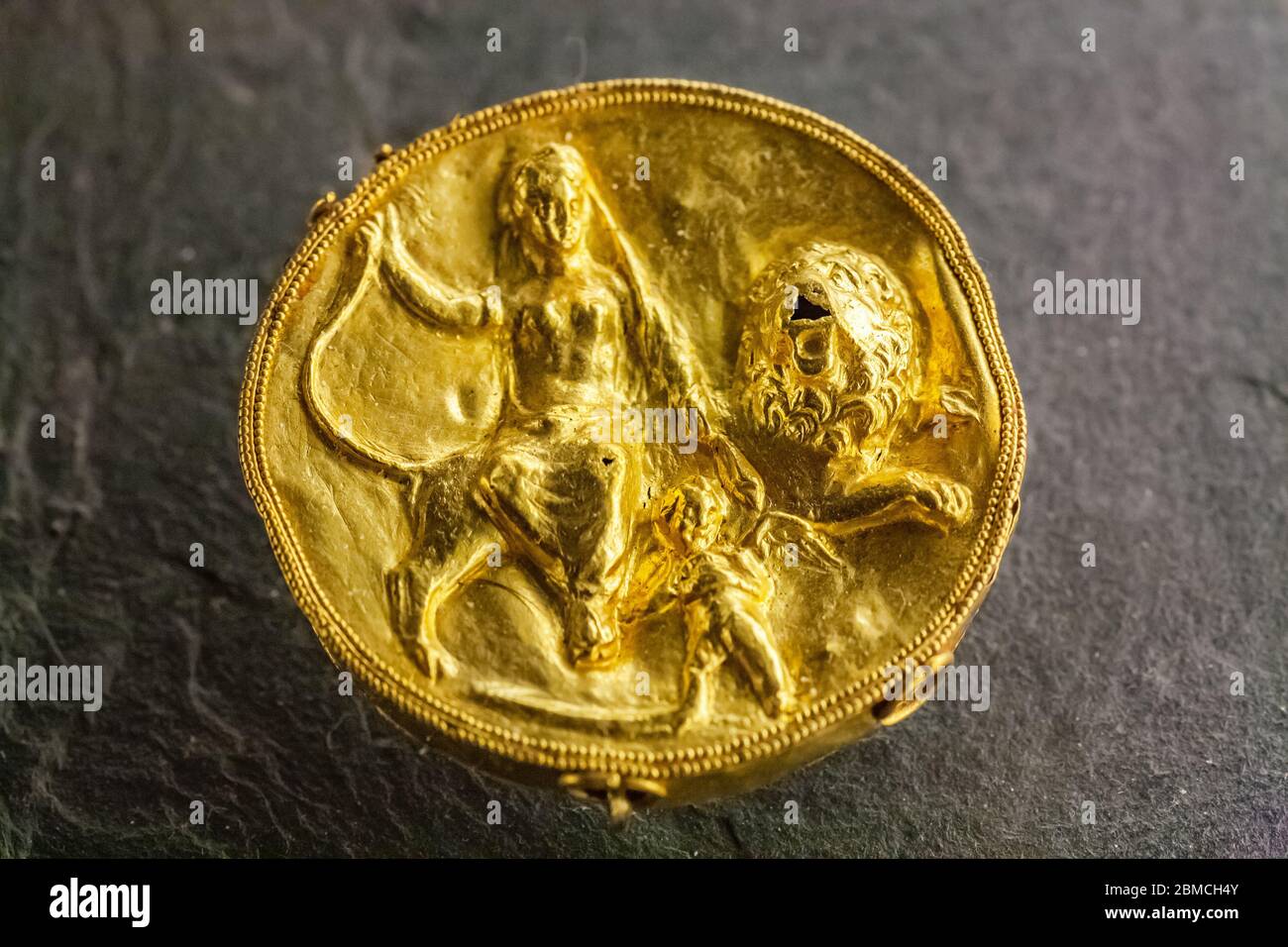 Gold medallion from the 3rd century BC, Syria exhibited in the Louvre, Paris Stock Photo
