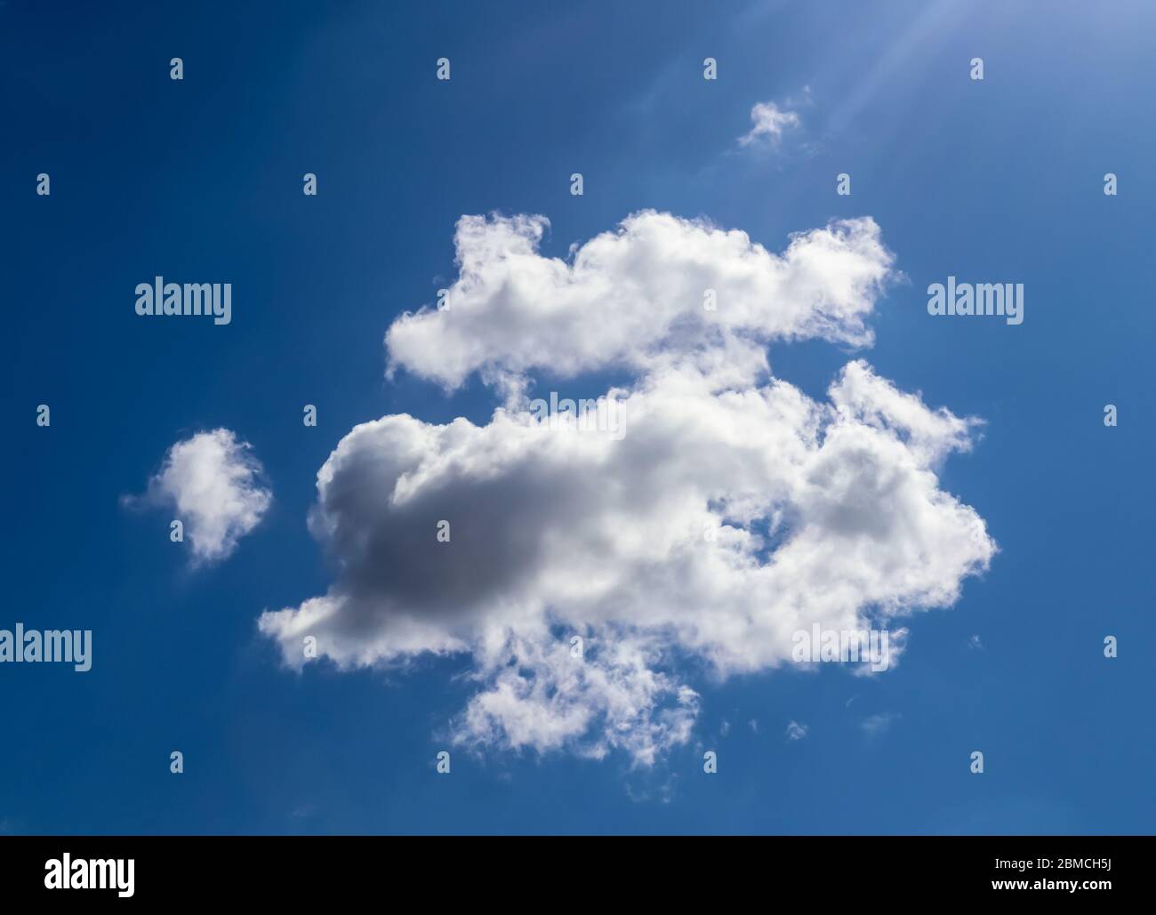 Beautiful white fluffy clouds in a deep blue summer sky Stock Photo - Alamy