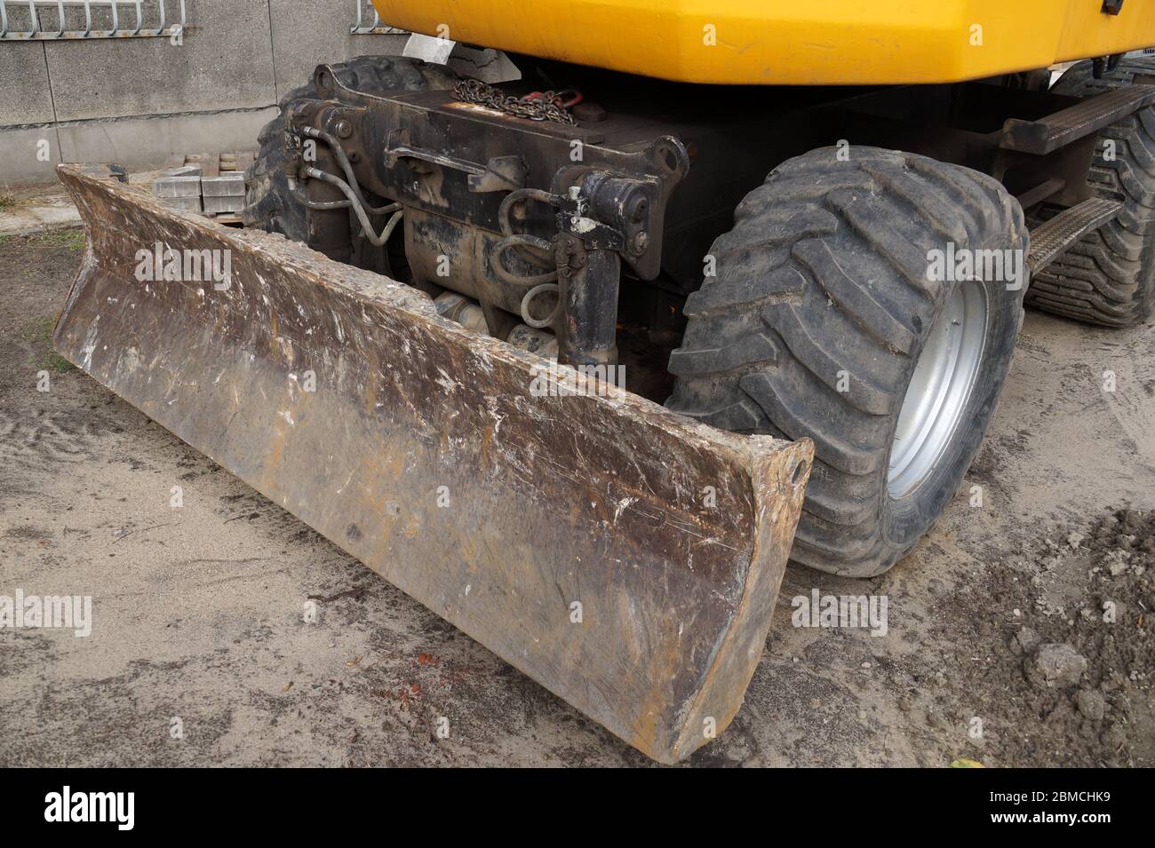 Close up of wheels and blade. Wheel excavator. Stock Photo