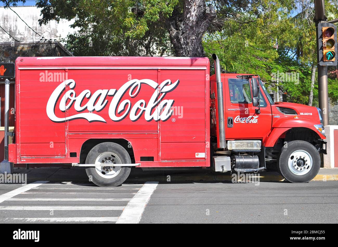 Image of a Coca cola truck parked in the street. Side view. Stock Photo