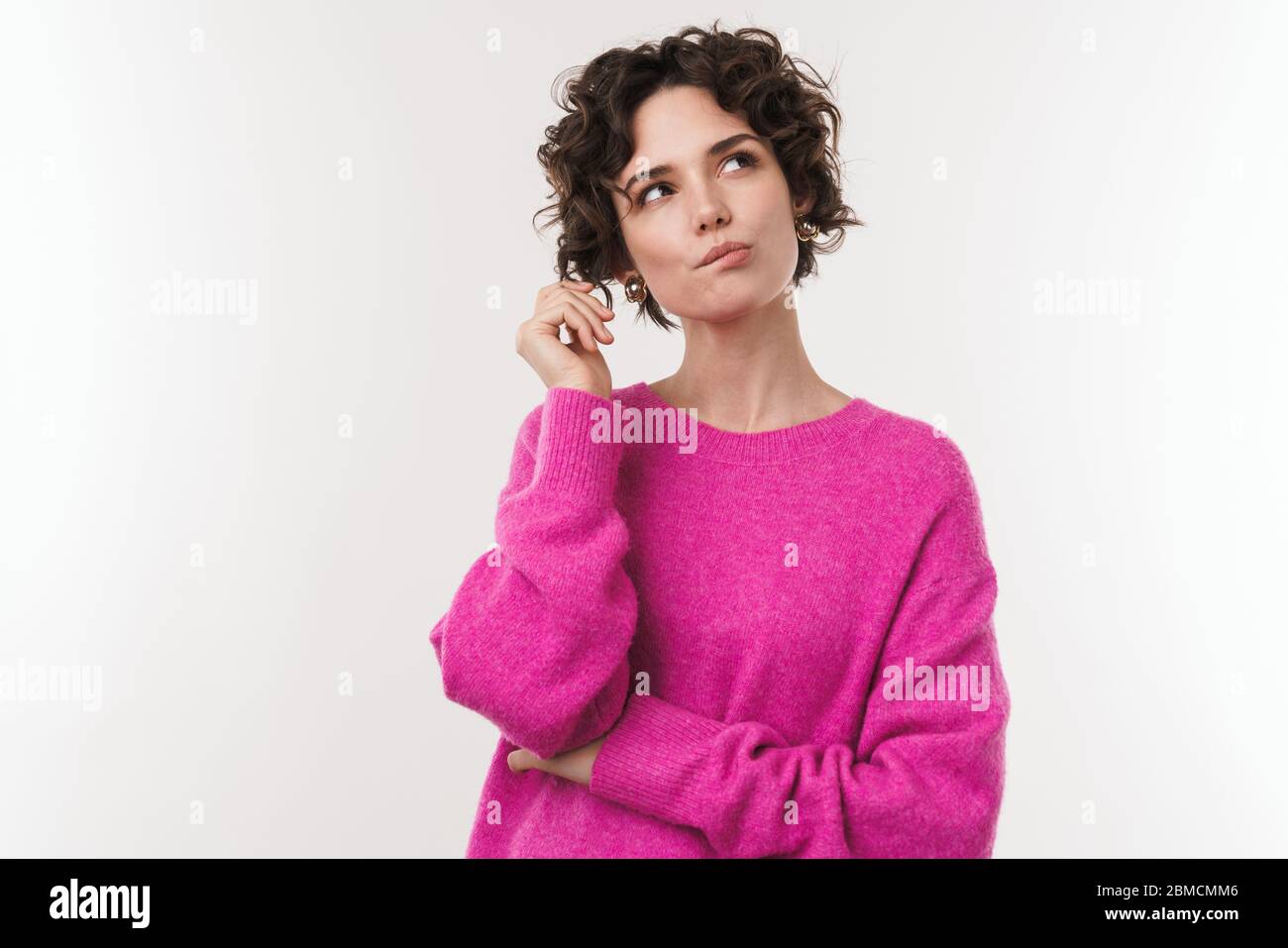 Image of serious beautiful woman thinking and looking upward isolated ...