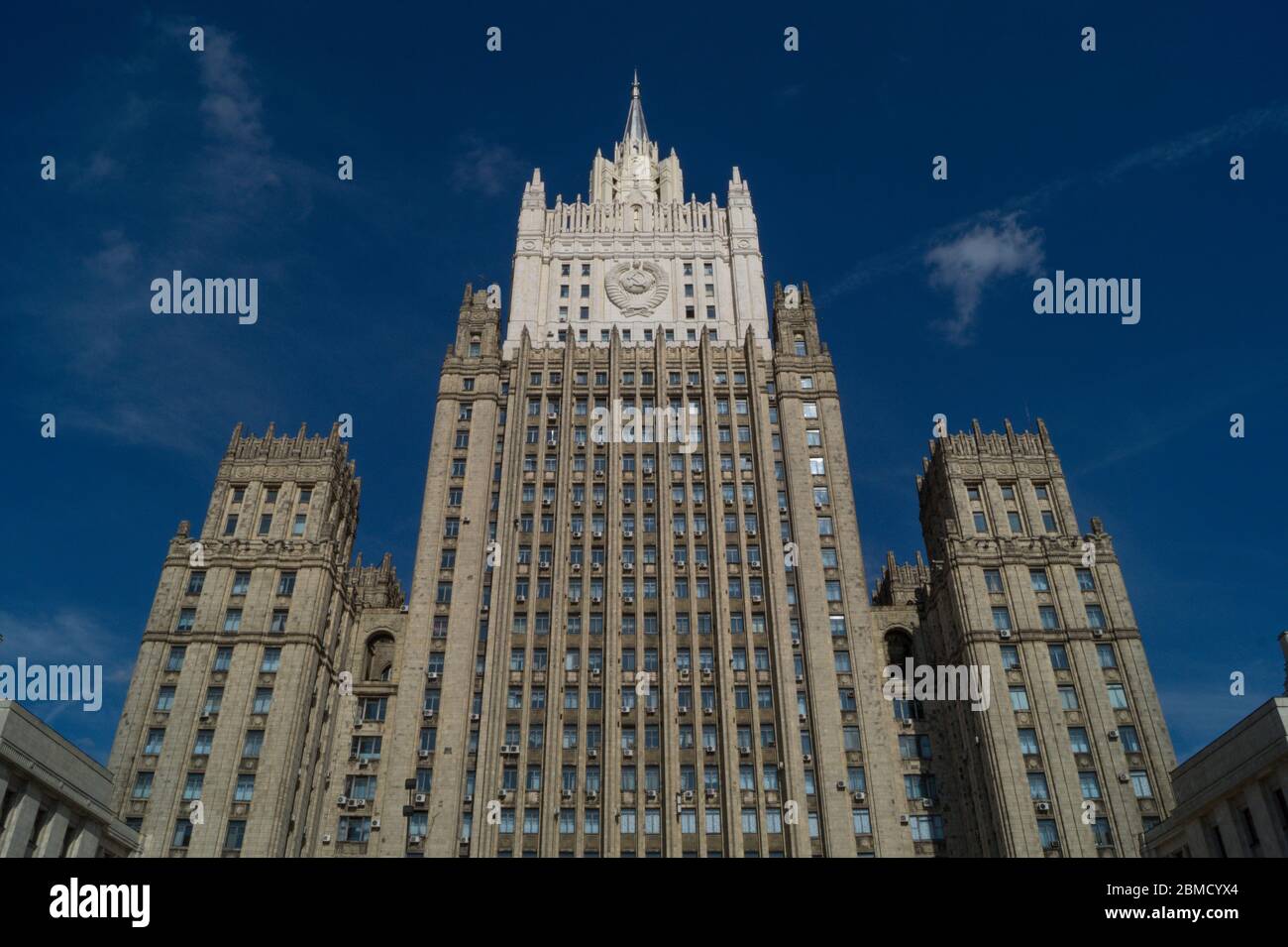 Central office of the Russian Ministry of Foreign Affairs in Moscow. Photographed from low angle against blue sky with white clouds. Stock Photo