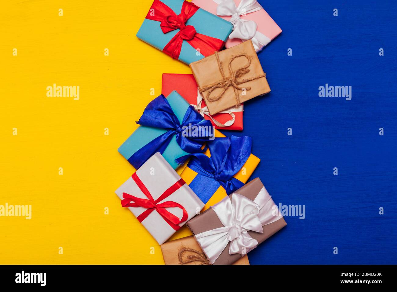 Multi-colored gifts on the birthday party background for inscriptions ...