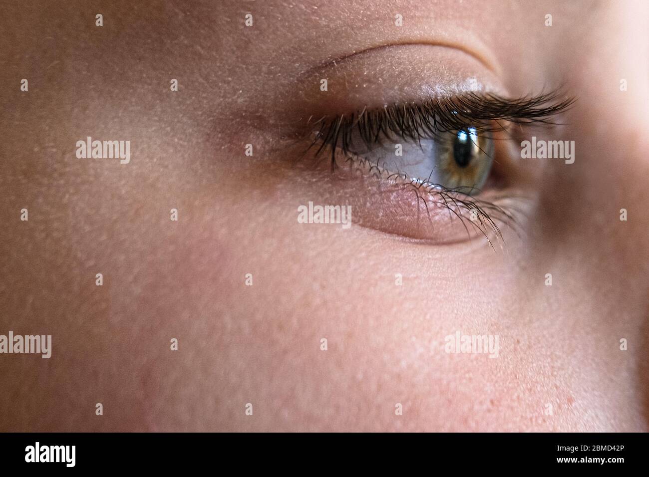 Close up view of kid eye vision detail,macro face skin portrait Stock Photo