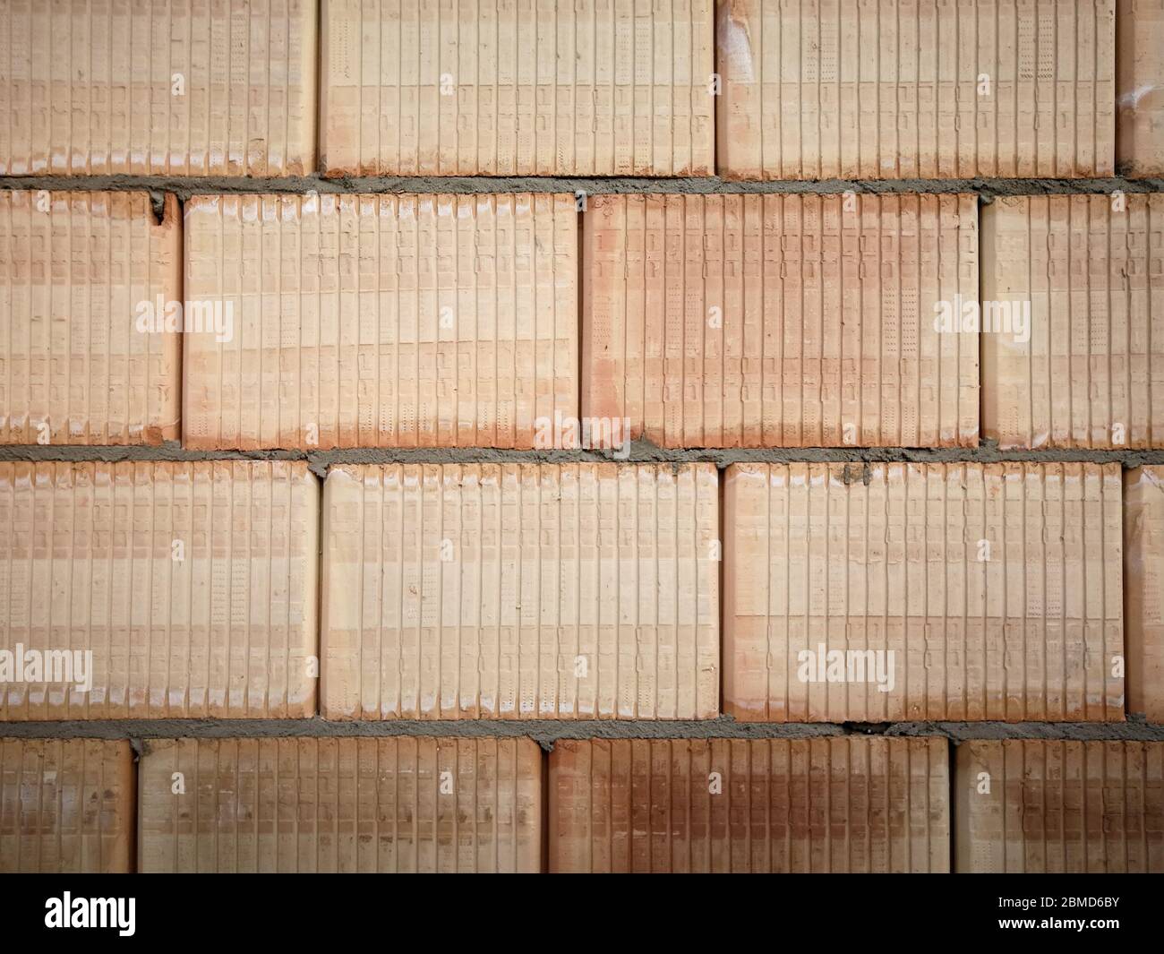 Abstract pattern of unfinished ceramic block wall. Construction site  abstract background Stock Photo - Alamy