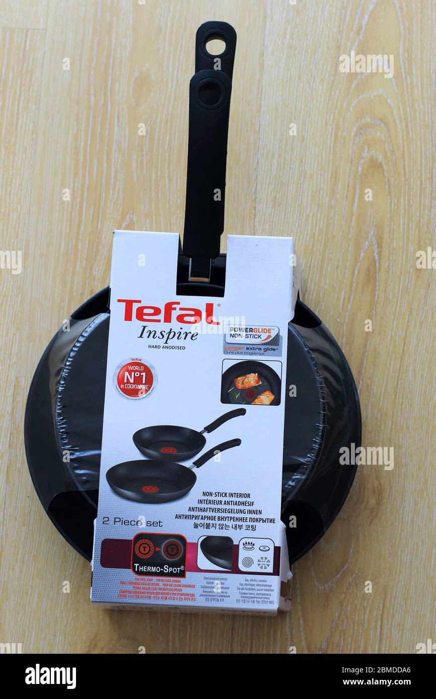 Brand New Tefal Inspire non stick pan against wooden background Stock Photo