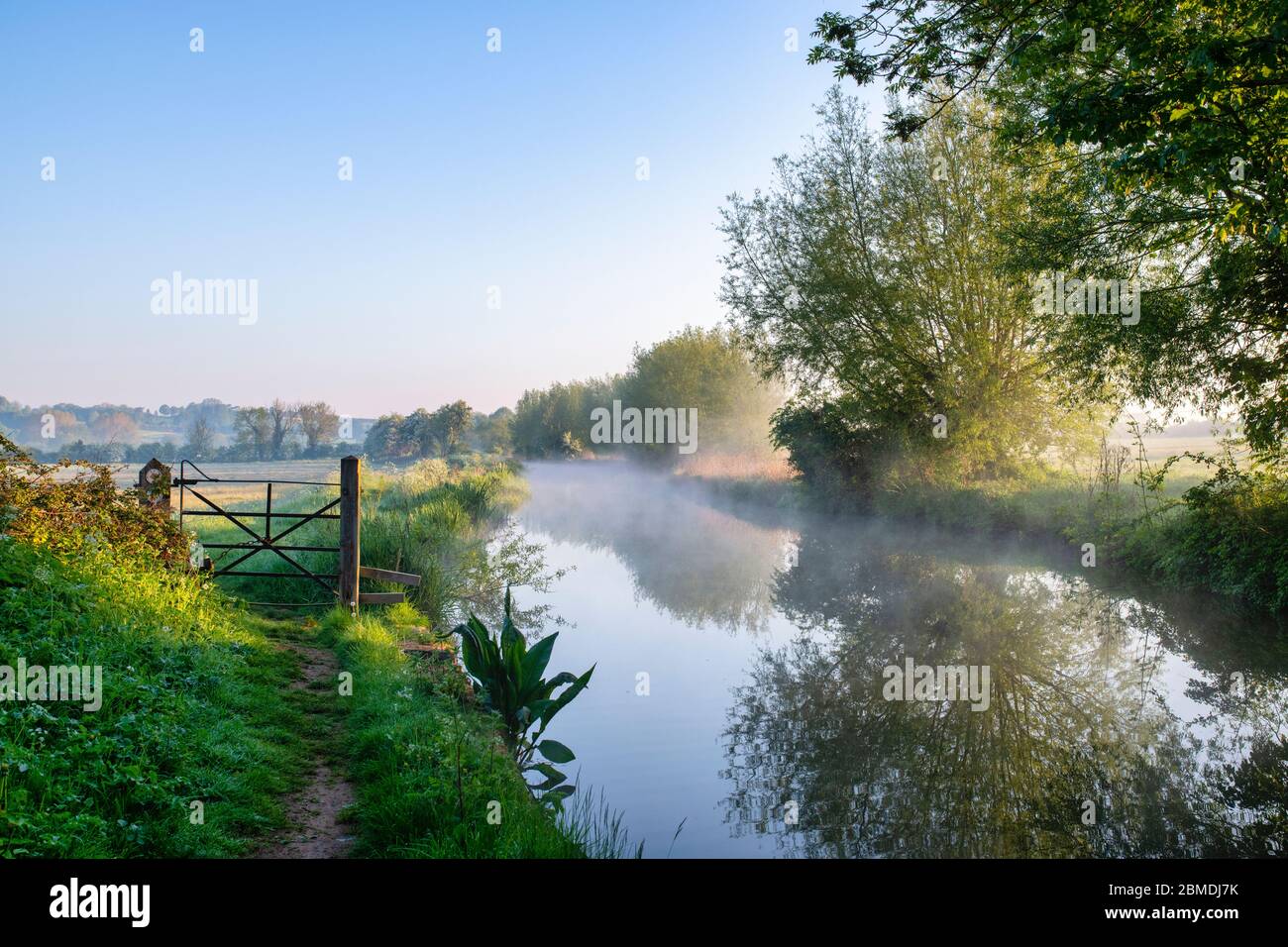 Mist on the oxford canal on a spring morning at sunrise. Near Somerton, Oxfordshire, England Stock Photo