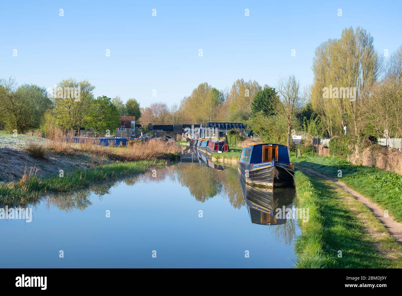 Narrowboats on the oxford canal early morning in spring. Heyford Wharf, Lower Heyford, Bicester, Oxfordshire, England Stock Photo
