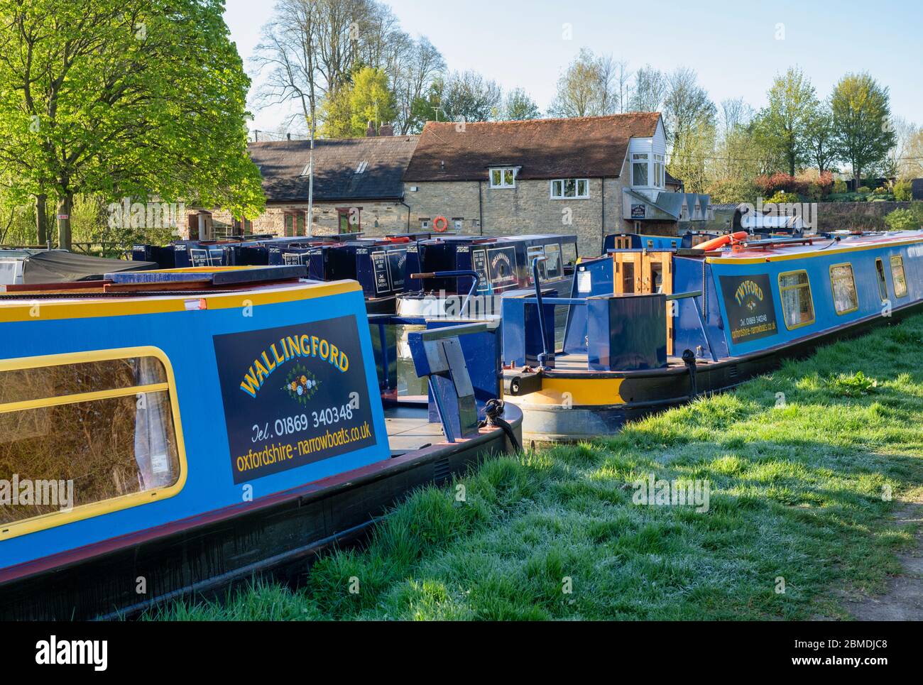 Narrowboats on the oxford canal early morning in spring. Heyford Wharf, Lower Heyford, Bicester, Oxfordshire, England Stock Photo